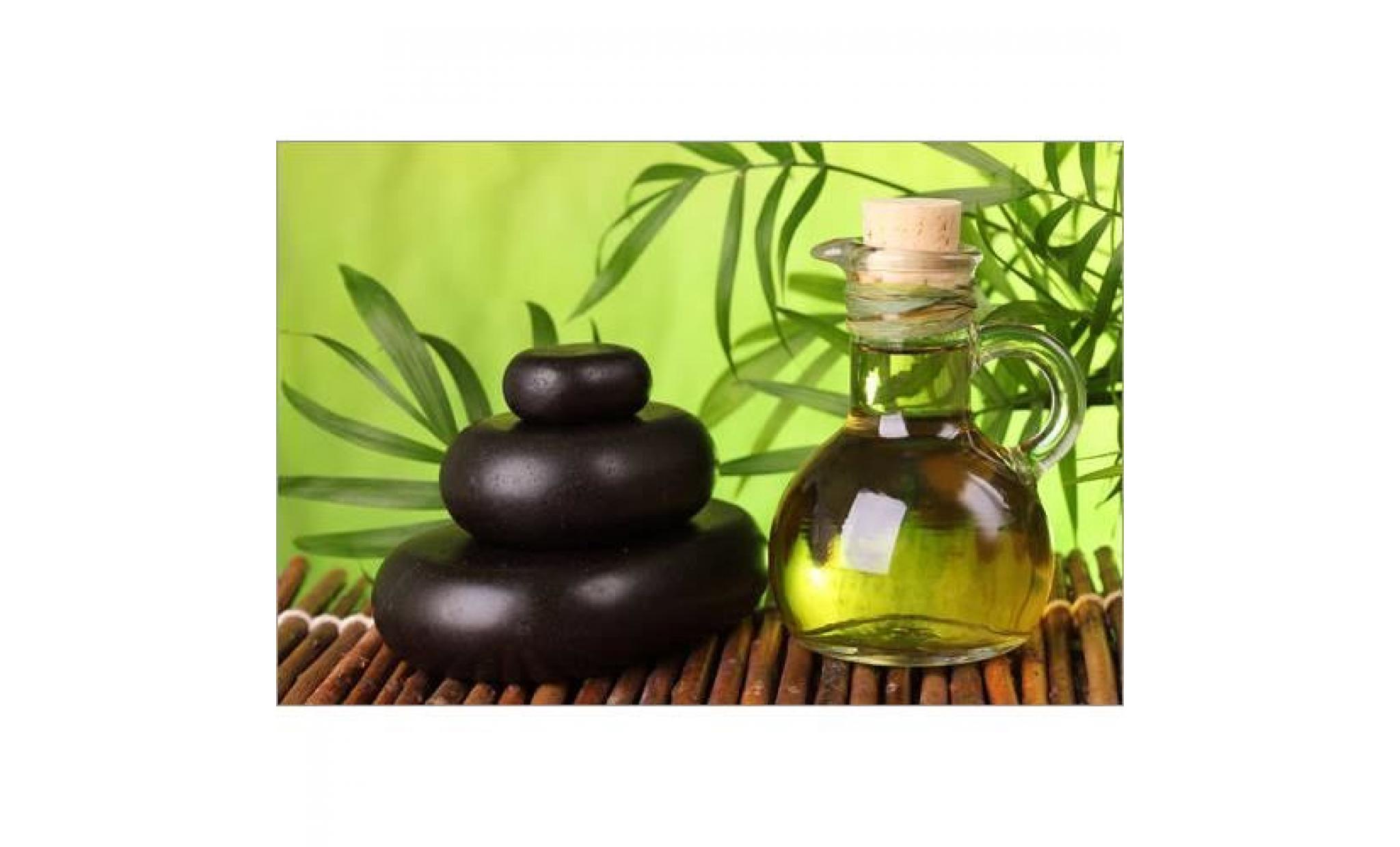 spa still life with hot stones and essential oil   elena schweitzer